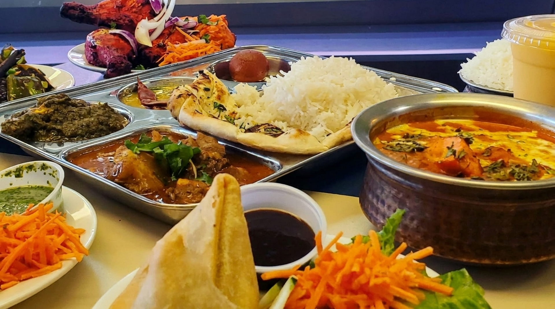 A curry house and a deli on JFK Boulevard